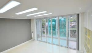 Big glass Bi fold doors white color