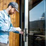 Man installing doors without frame