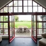 Room with doors open onto patio