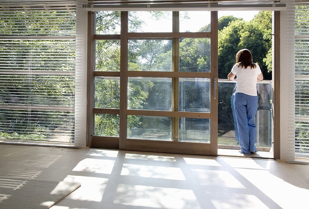 View through an empty room with blinds