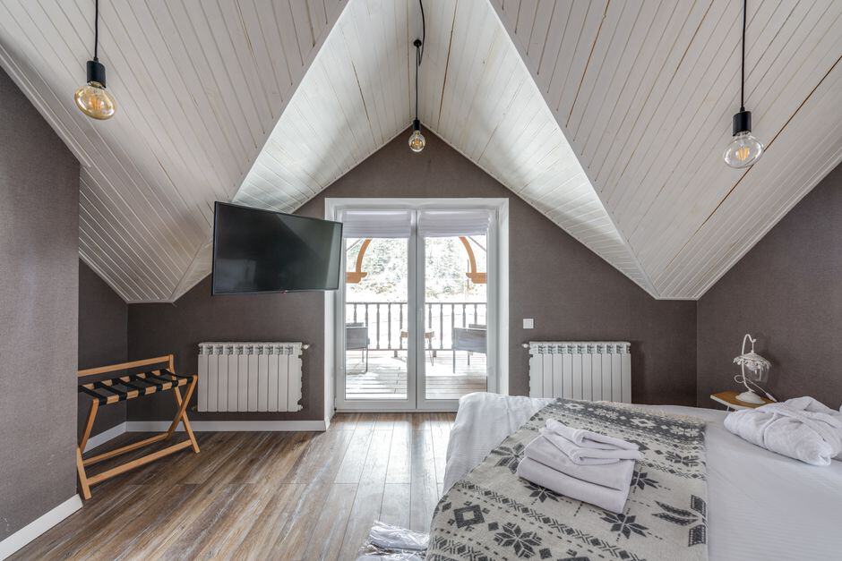 Attic bedroom with glass French doors