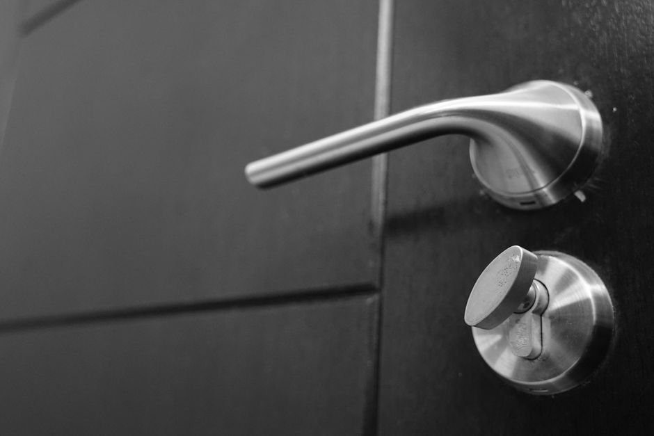 Lever door handle on a dark gray door