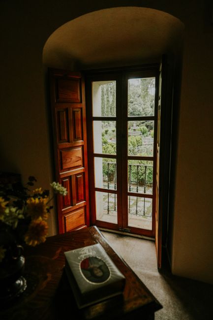 Wooden French doors with glass panes leading to a garden