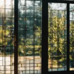 An image showcasing a close-up of a French door's glass panel, revealing its pristine, evenly distributed tempered glass