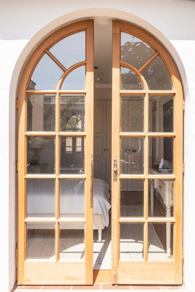 arched-top French doors with clear glass panels