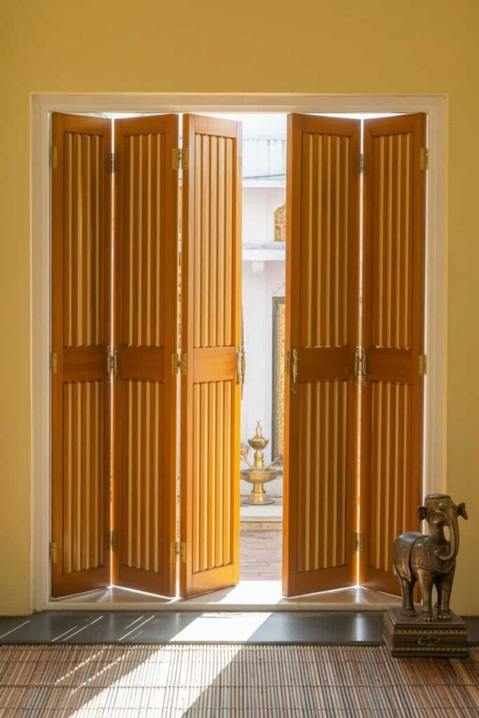multi-panel folding accordion-style mandir doors